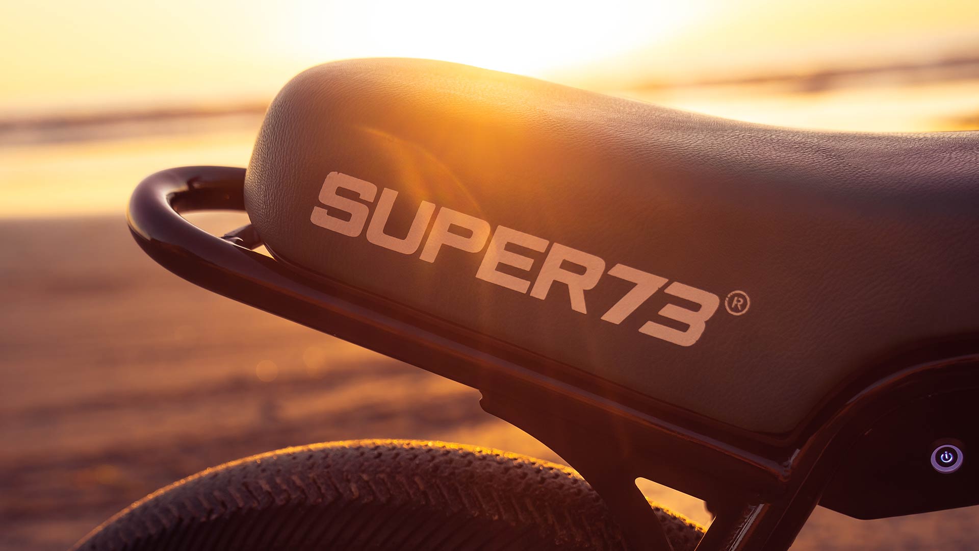 A SUPER73 seat gleaming in the sunset.