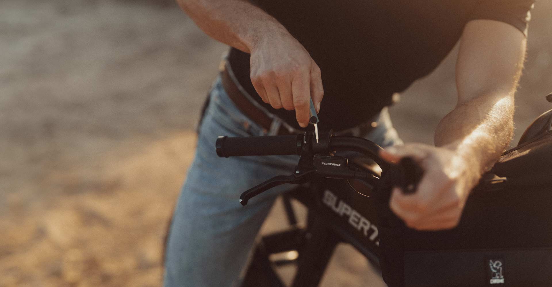 lifestyle image of a SUPER73 rider preparing for his ride.