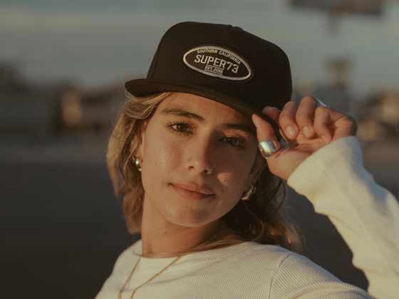 Female model reppin the new hat from the apparel collection