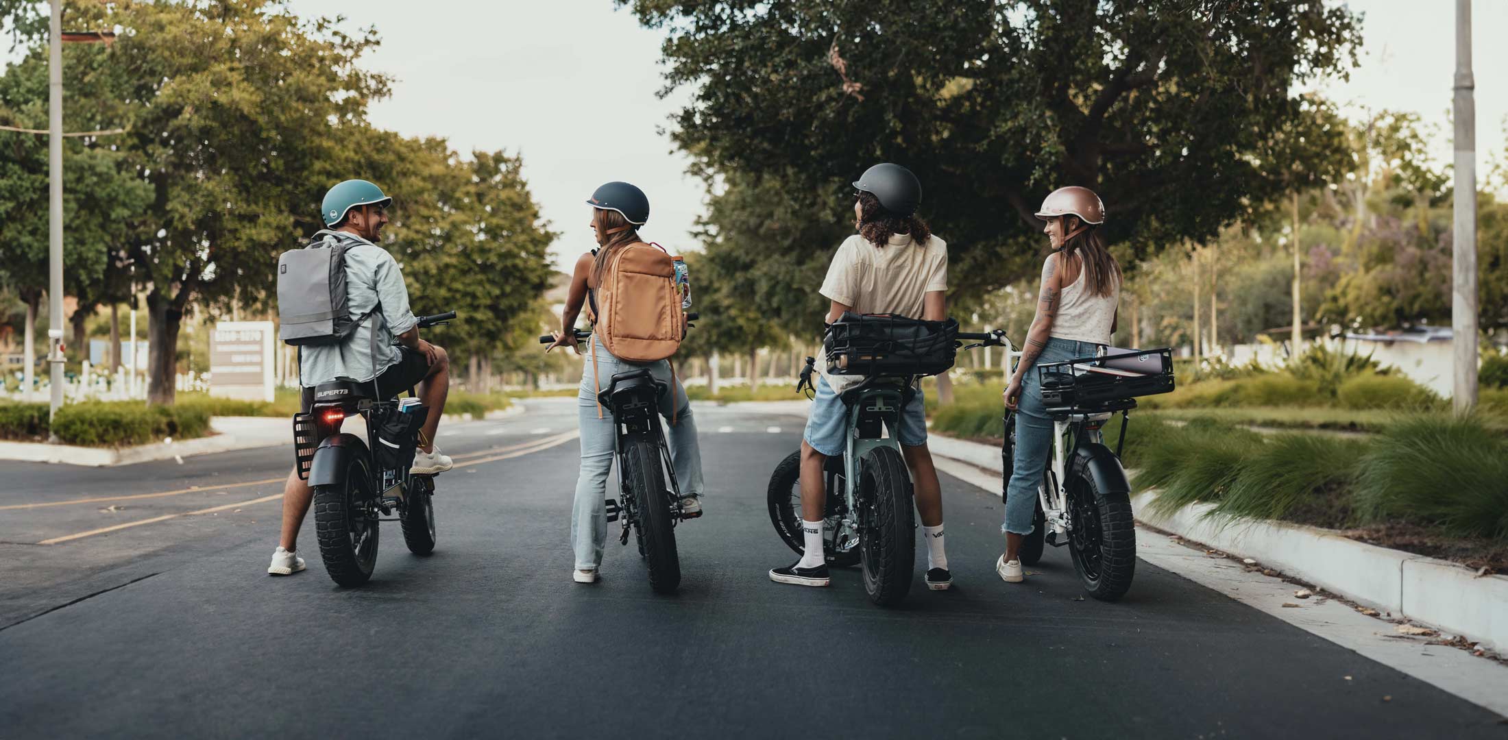 Lifestyle image of a bunch of friends heading to school on their Super73s