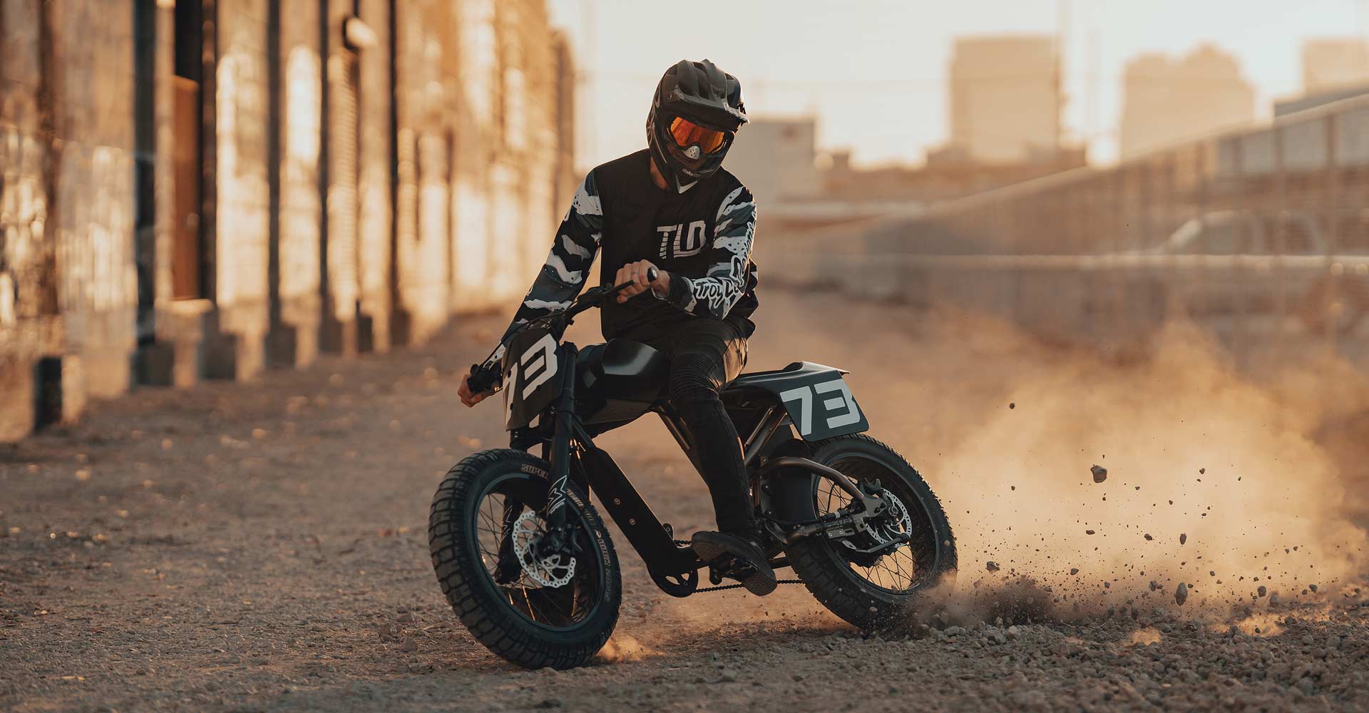 image of a rider riding his super73 through a dirt path