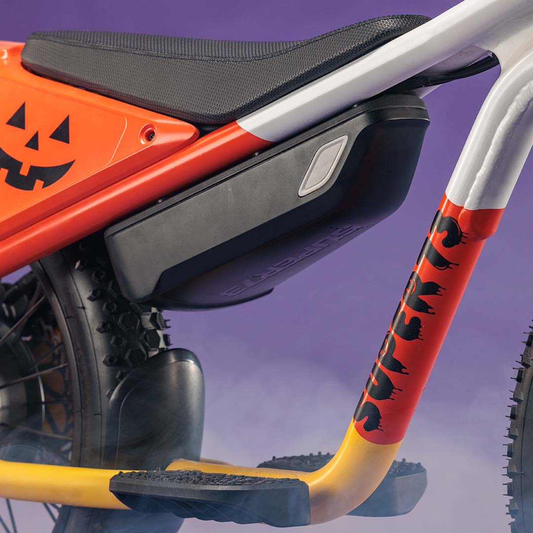 Closeup of the SUPER73-K1D Candy Corn Cruiser showing the paint detail.