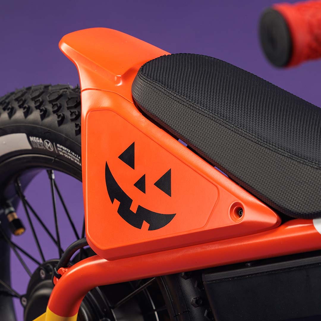 Closeup of the SUPER73-K1D Candy Corn Cruiser showing the paint detail.