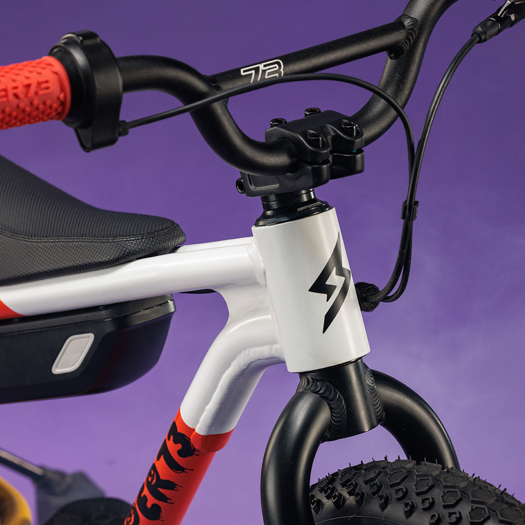 Closeup of the SUPER73-K1D Candy Corn Cruiser showing the paint detail.