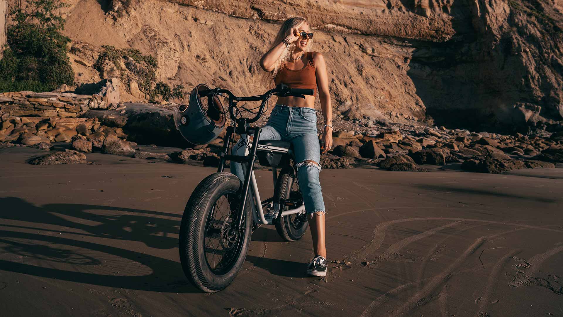 Young woman on a Super73 Z Series ebike sitting and watching the sunset