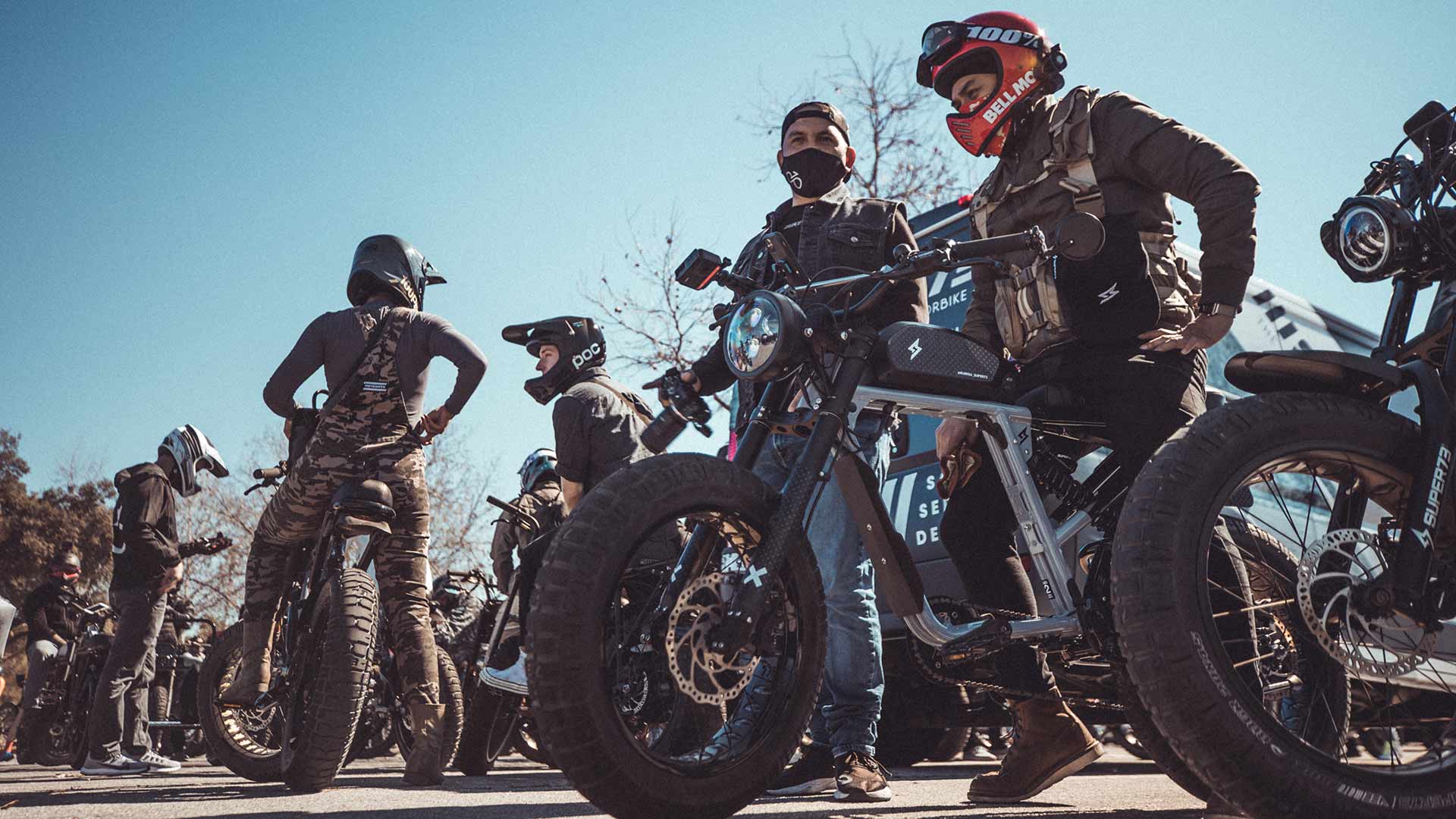 Super Squad members preparing for group ride on Super73 bikes