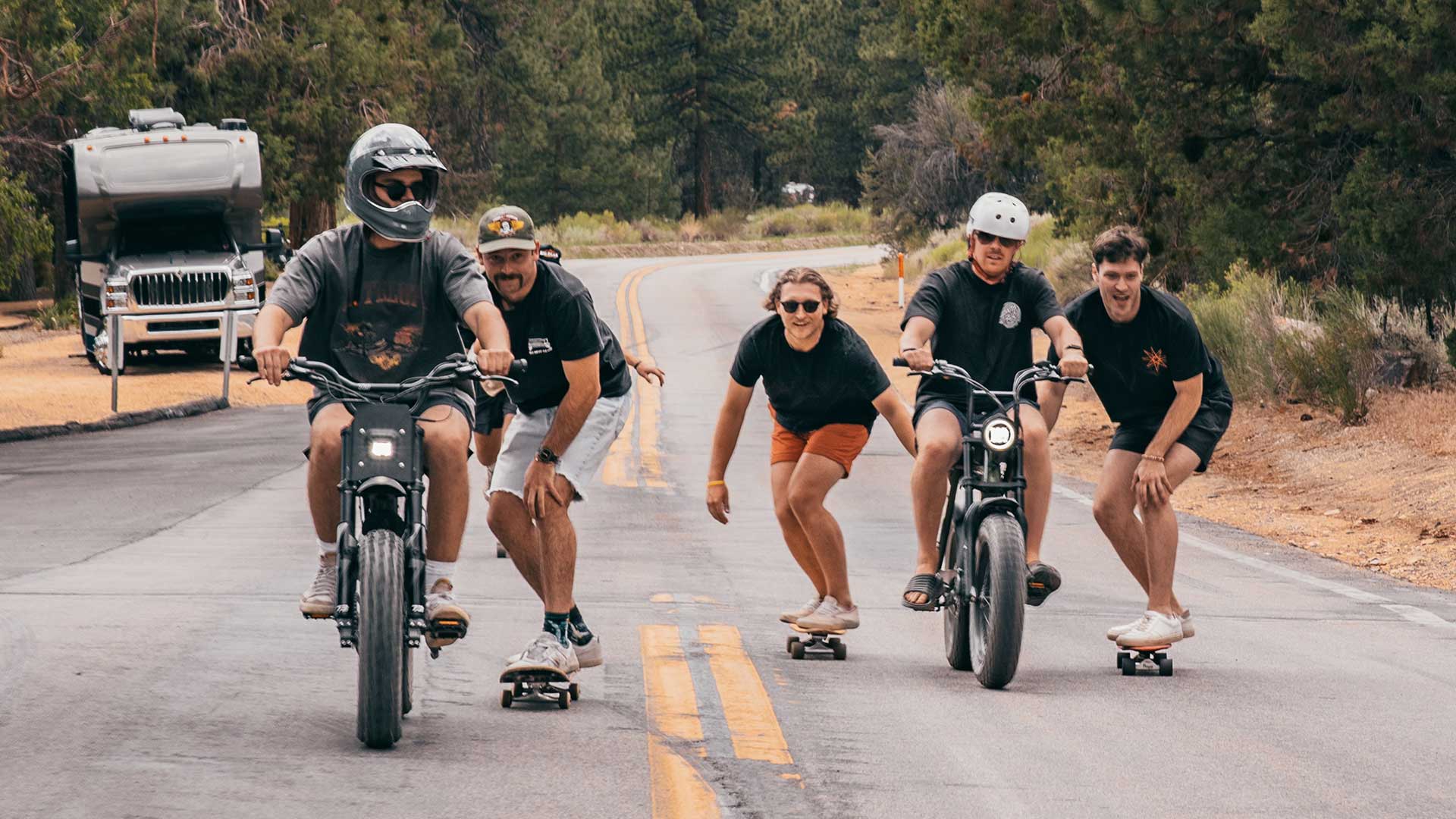 Super73 ebikes pulling riders on skateboards