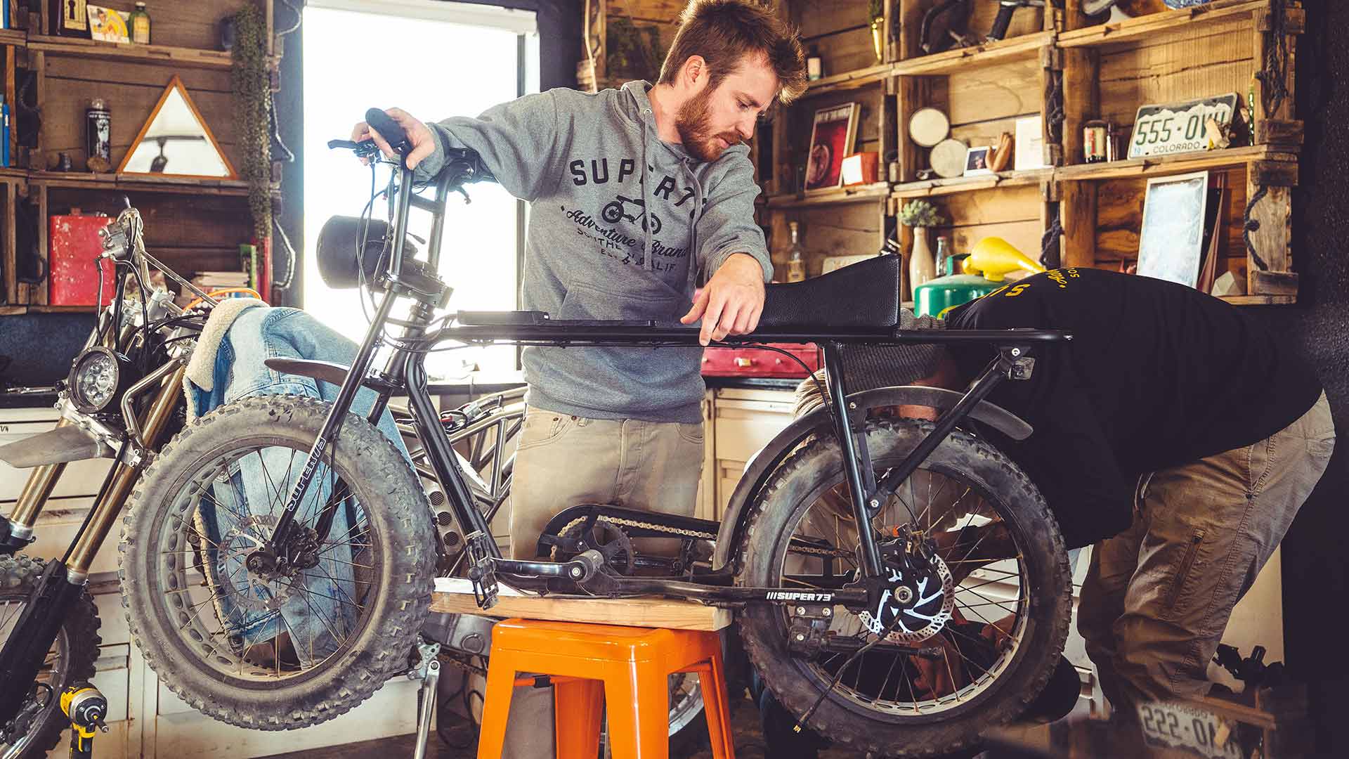 mechanics working on ebike in a garage