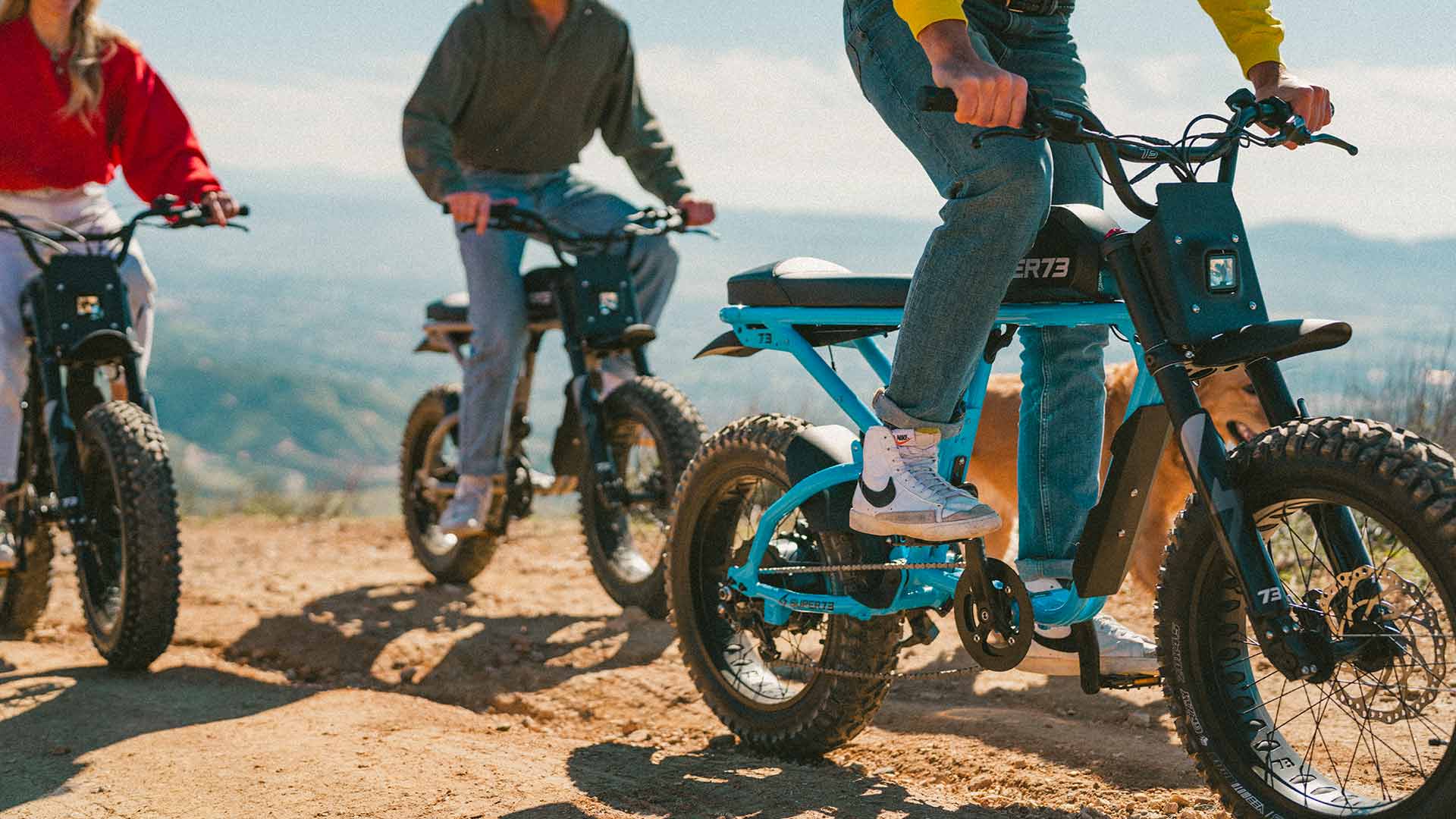 Lifestyle image of a group of friends riding their Super73 ebikes.