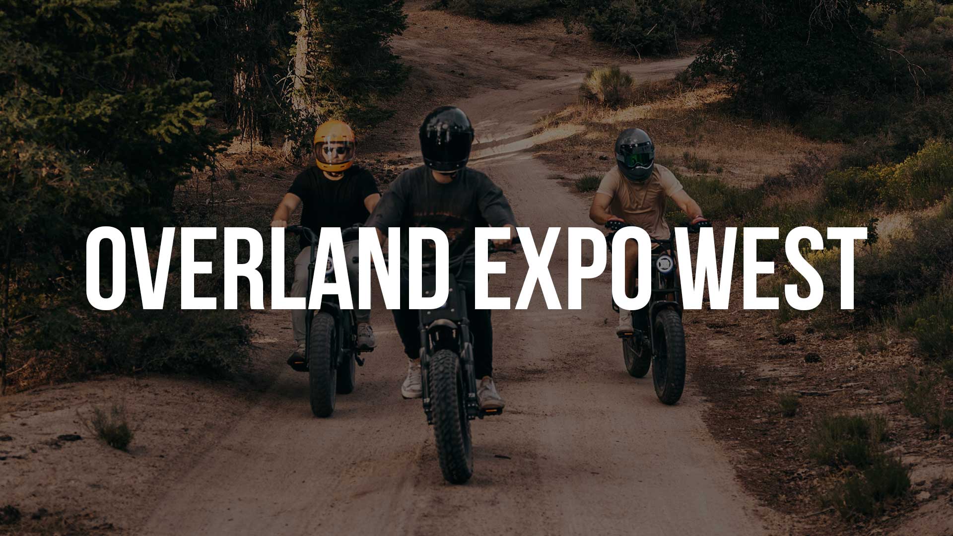 Graphic of ebike riders in the background with text overlaid as OVERLAND EXPO WEST