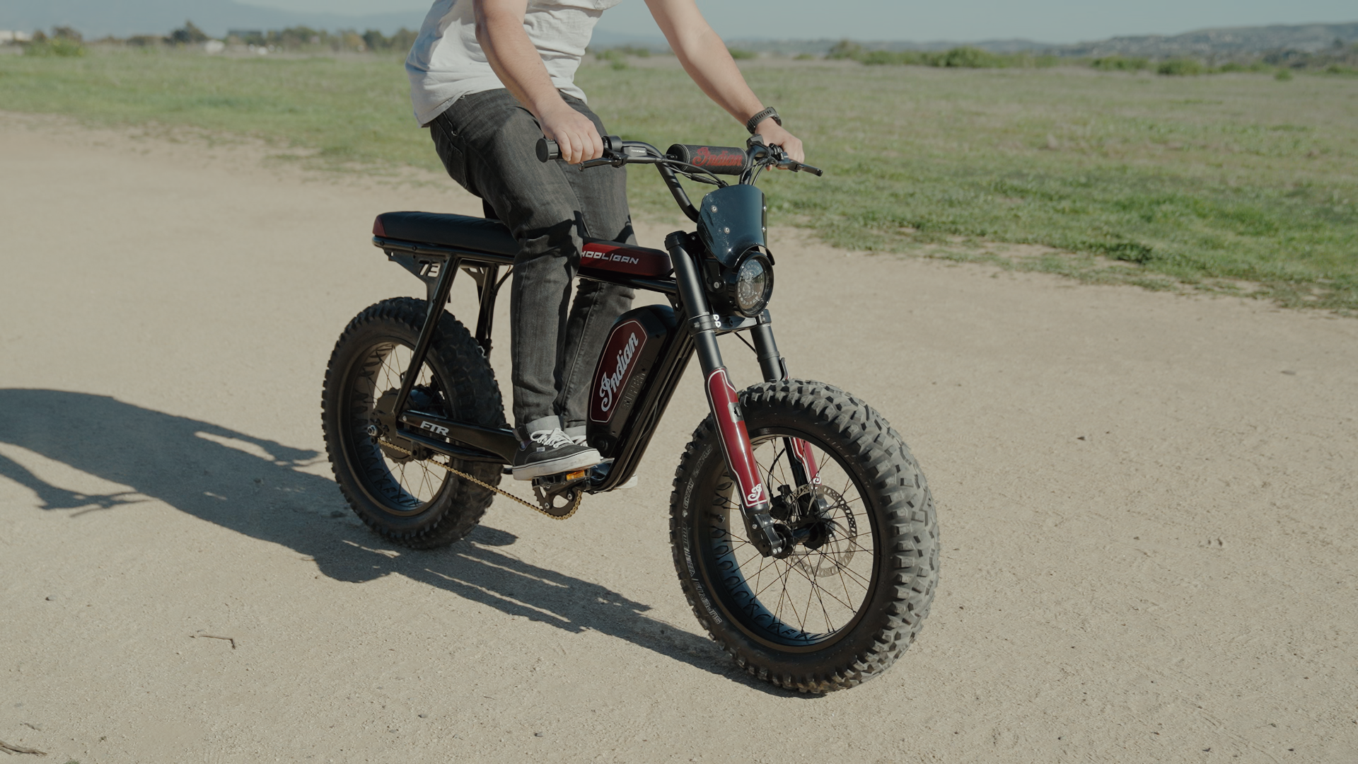 Young man riding a SUPER73 Indian ebike down the street