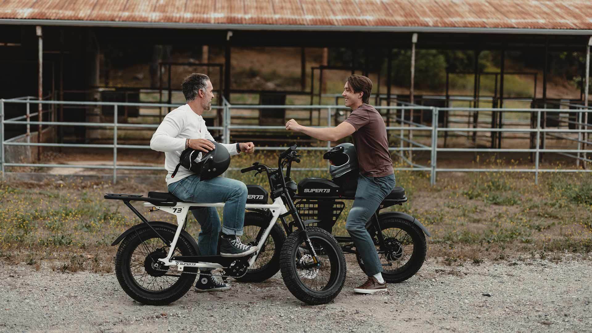 A dad and his son enjoying their SUPER73 ebikes.