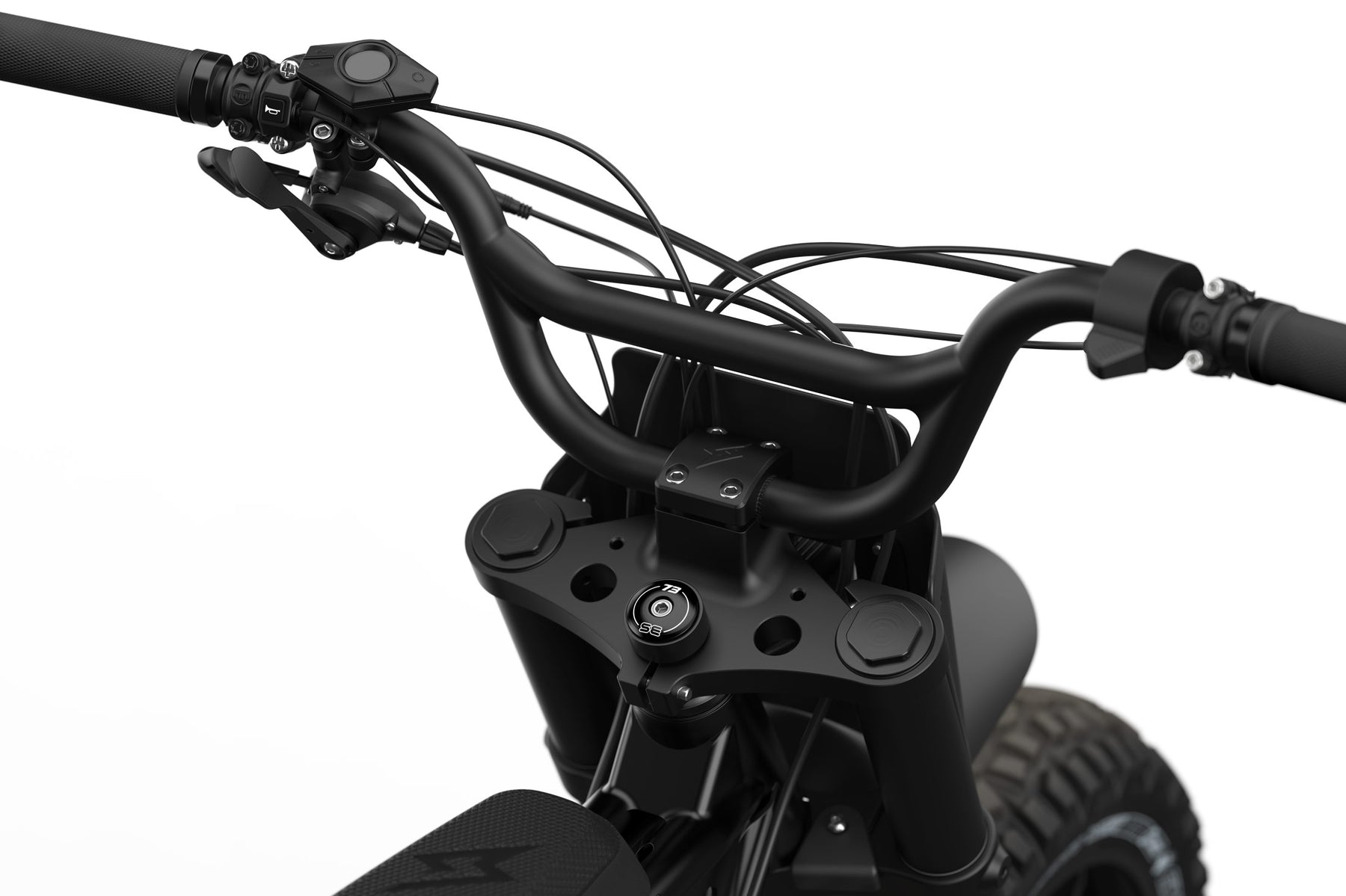Detail shot of the branded stem cap on the SUPER73-S Blackout SE bike.