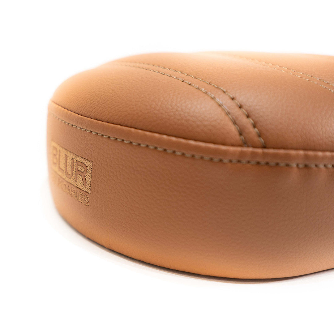 Brown Caterpillar seat back with Blur Industiries logo embroidered  in brown stitching