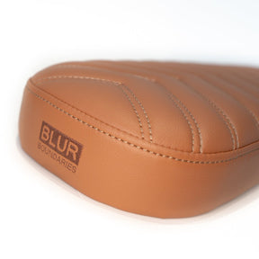 back of the 2-up caramel chevron stitched seat  with Blur Boundaries logo embroidared 