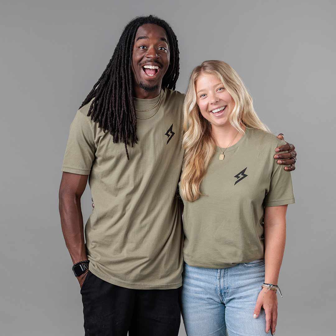 Studio image of The Trailblazer Tee (Light Olive) on both male and female models 