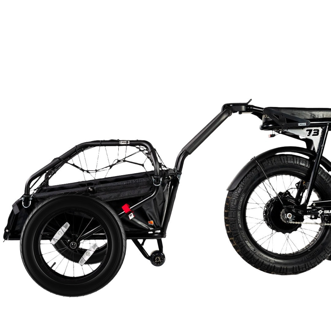 Side view of the Earth+Kin ebike trailer attached to a SUPER73-S2 ebike.