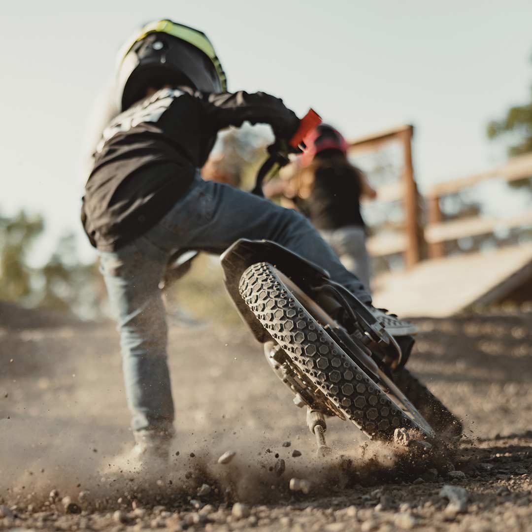 Lifestyle image of a kid riding his K1D featuring the K1D Mega Hex Tire 16in. x 2.4in.