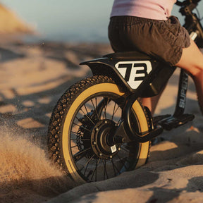 Lifestyle image of a kid riding his K1D featuring the K1D Mega Hex Tire 16in. x 2.4in.