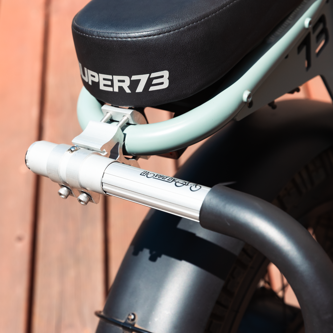 Close-up of the rear bar of the MBB Dual Sport Surf Rack, installed on a SUPER73-S2 Laguna ebike.