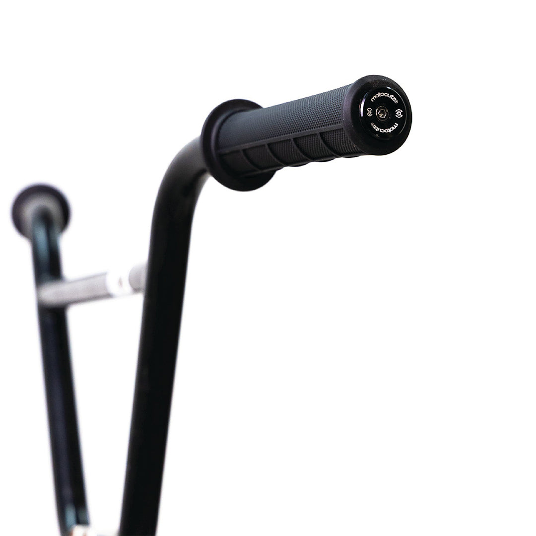Close-up of the MotoCutz Mid Flange Bolt-On Grips in Black on a handlebar.