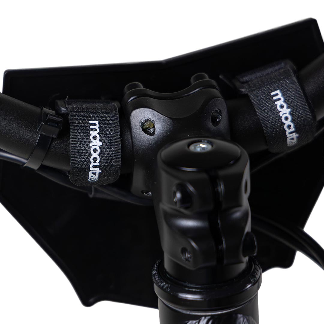Back side view of the MotoCutz Micro Race Plate in Black installed on handlebars