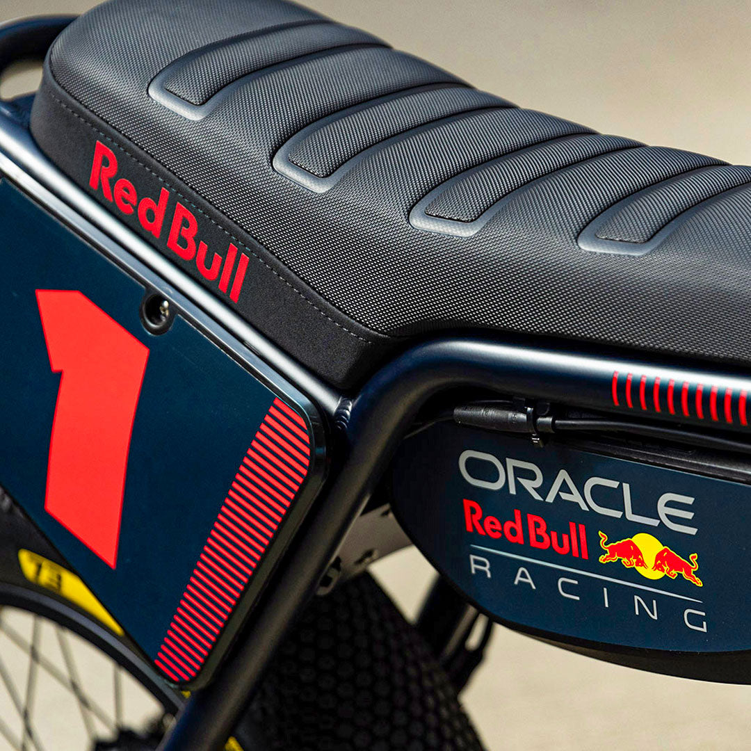 Lifestyle image showing the custom branded decals and removable battery on the Oracle Red Bull Racing x SUPER73 Z Adventure Series ebike