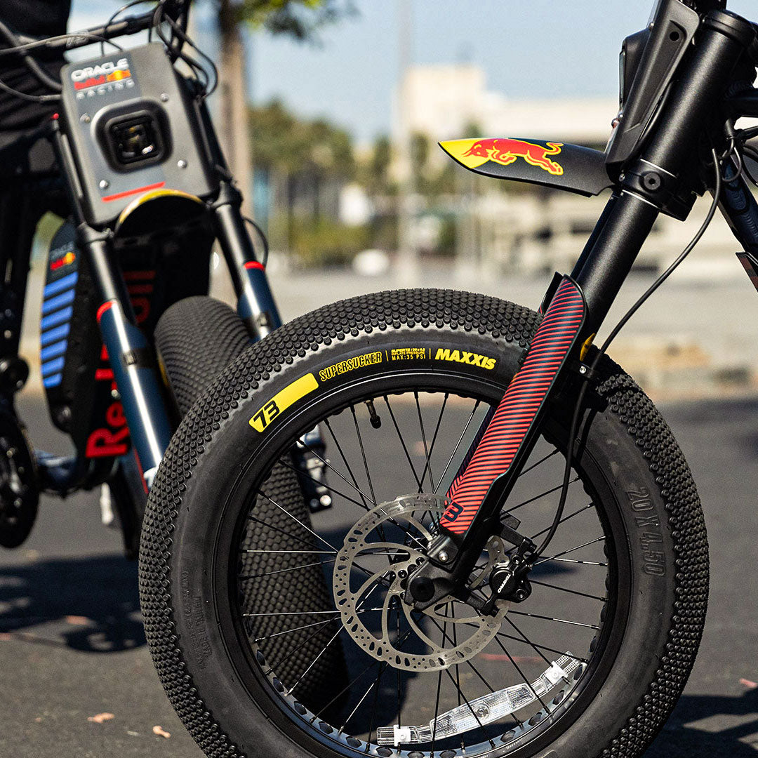 Lifestyle image showing the MAXXIS SuperSucker tires on the Oracle Red Bull Racing x SUPER73 R Adventure Series and Z Adventure Series ebikes.