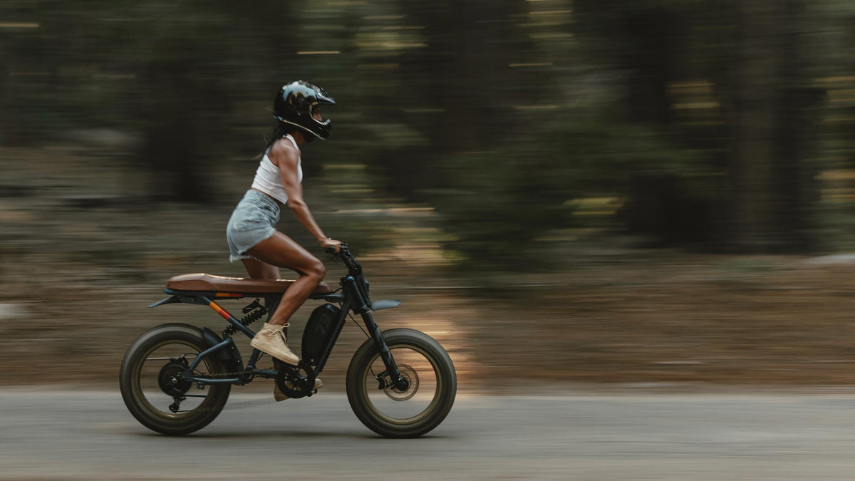 lifestyle image of a female rider cruising on her SUPER73 R Adventure