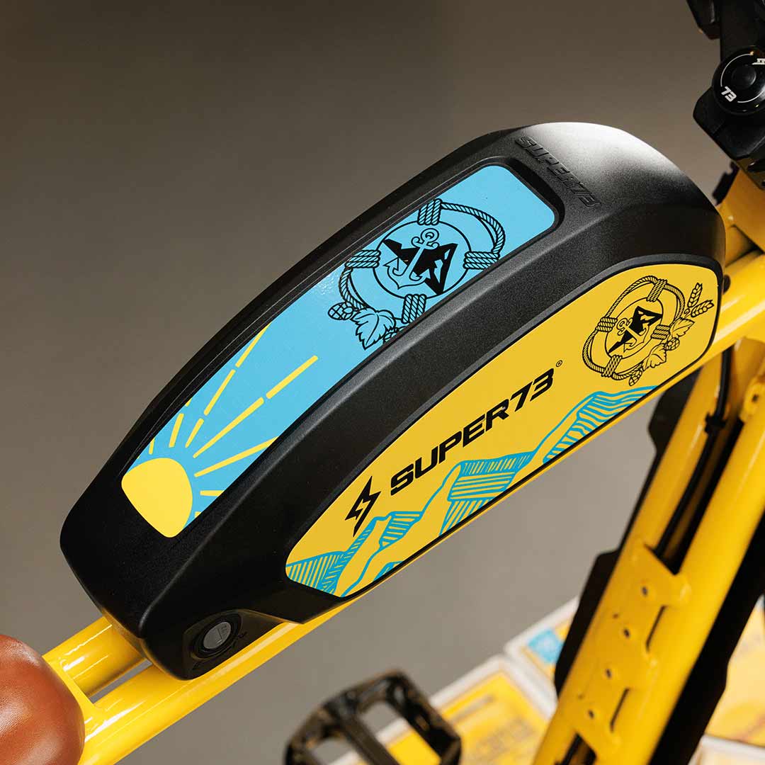 Close-up photo of the custom Pacifico x SUPER73-S2 bike battery with decals.