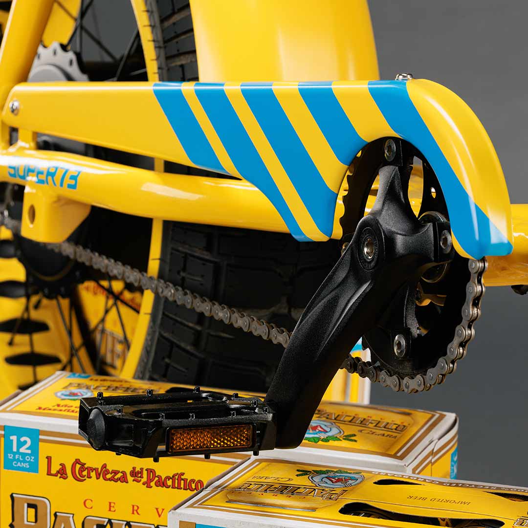 Close-up photo of the custom Pacifico x SUPER73-S2 bike striped chain guard.