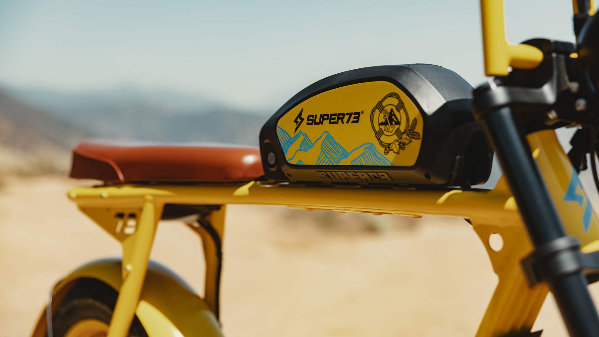 Close-up image of the custom Pacifico x SUPER73-S2 bike battery with branded decals.