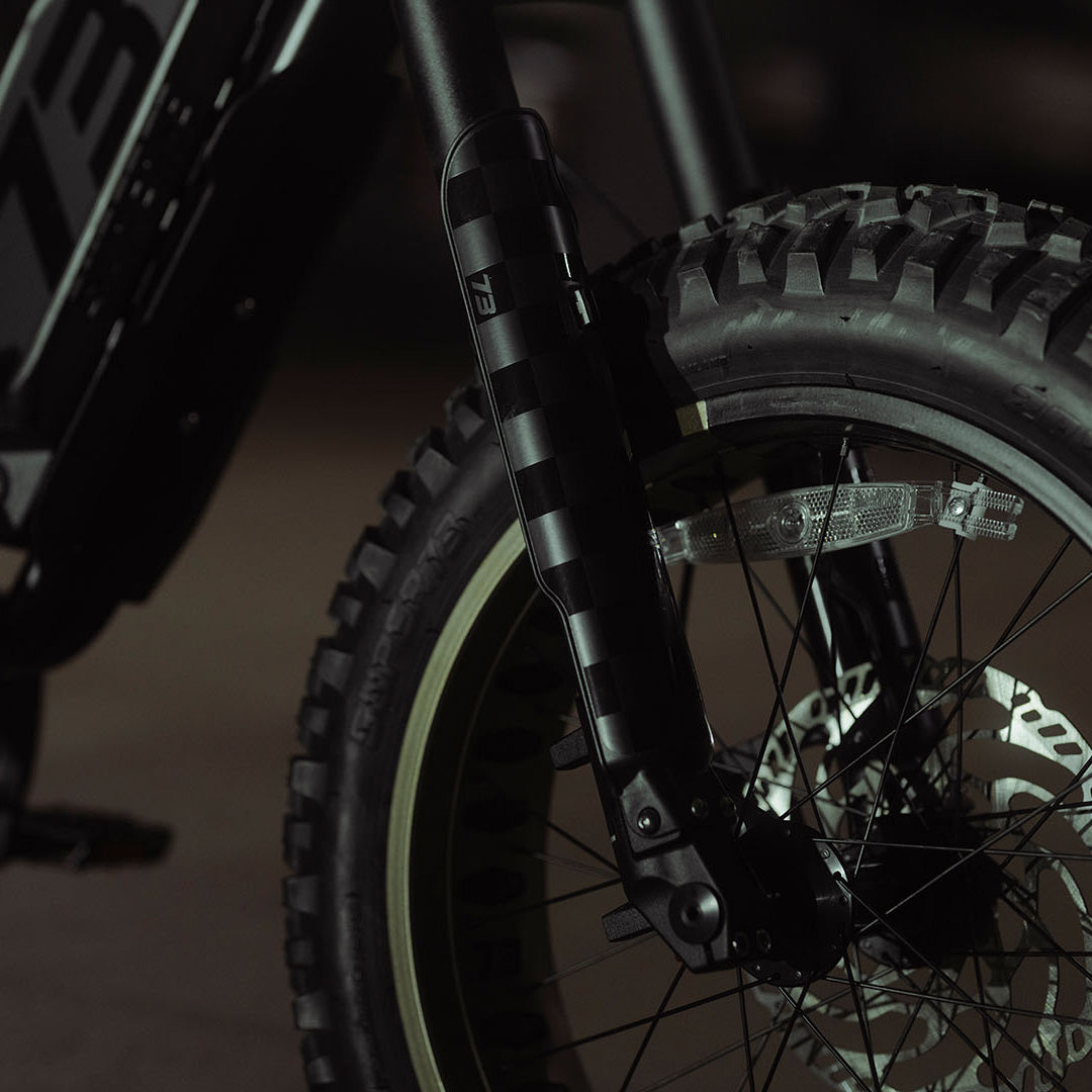 Close-up image of the front tire of the SUPER73-R Adventure SE ebike in Bandit