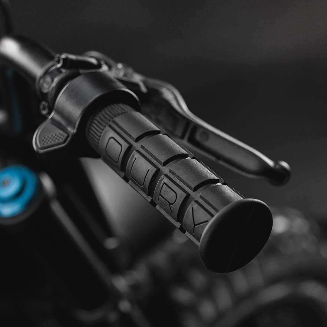 Detail image of the Oury grips and throttle on a SUPER73-R Blackout SE bike.