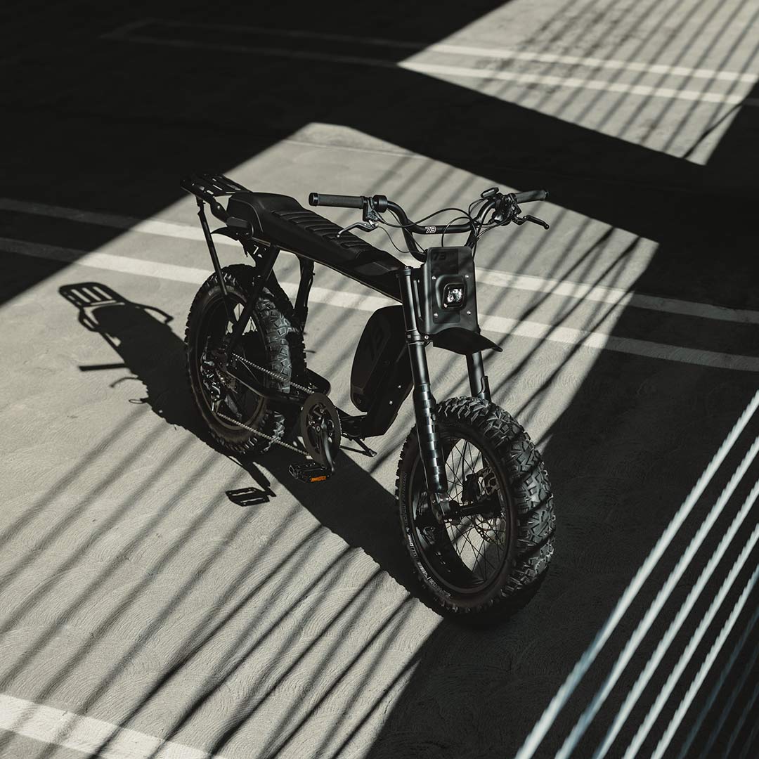 Image of a SUPER73-S Blackout SE bike in a parking garage.