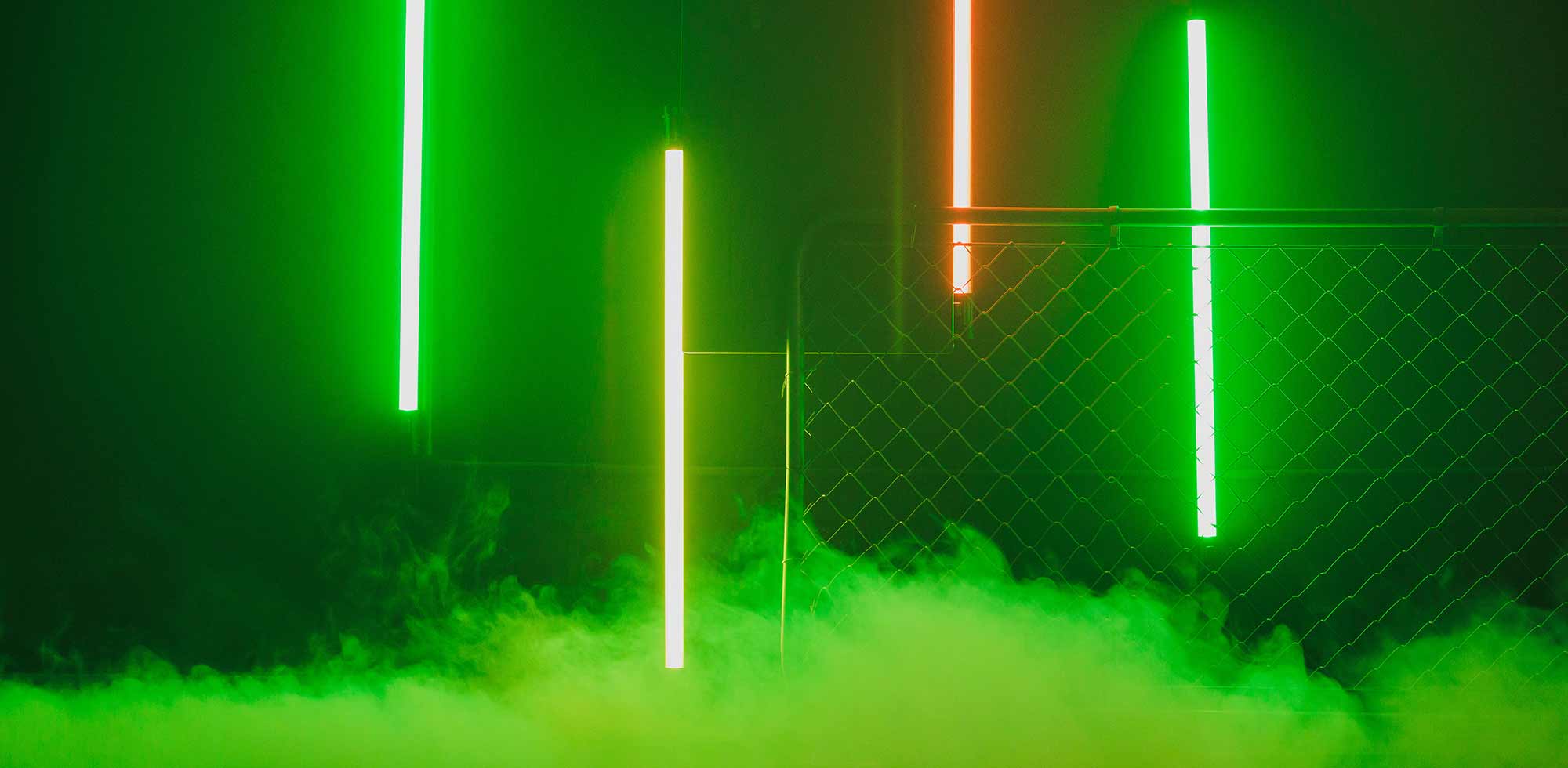 A green smokey background with neon lights