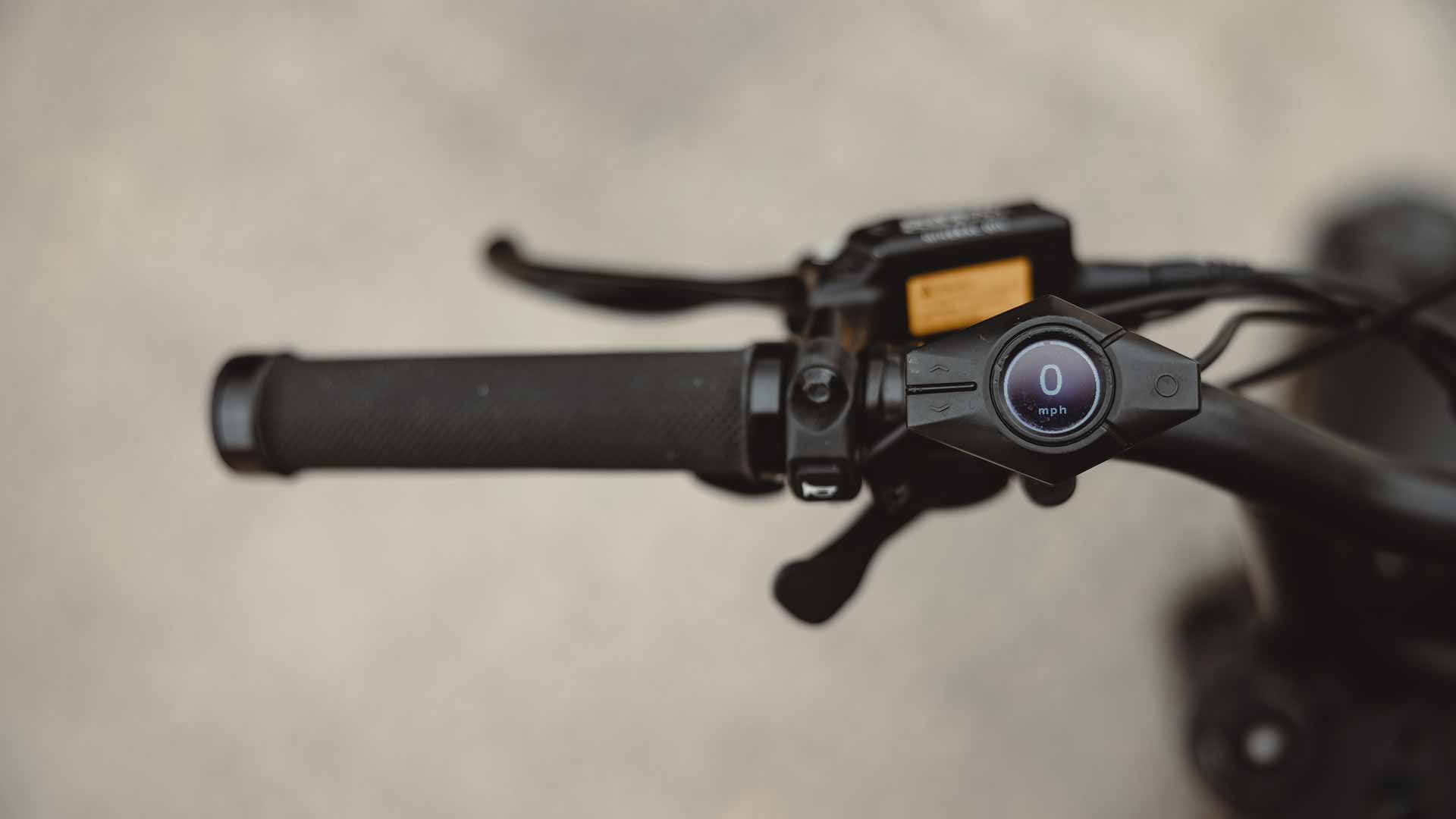 Closeup of the Super73 Z Adventure smart display located on the handlebar