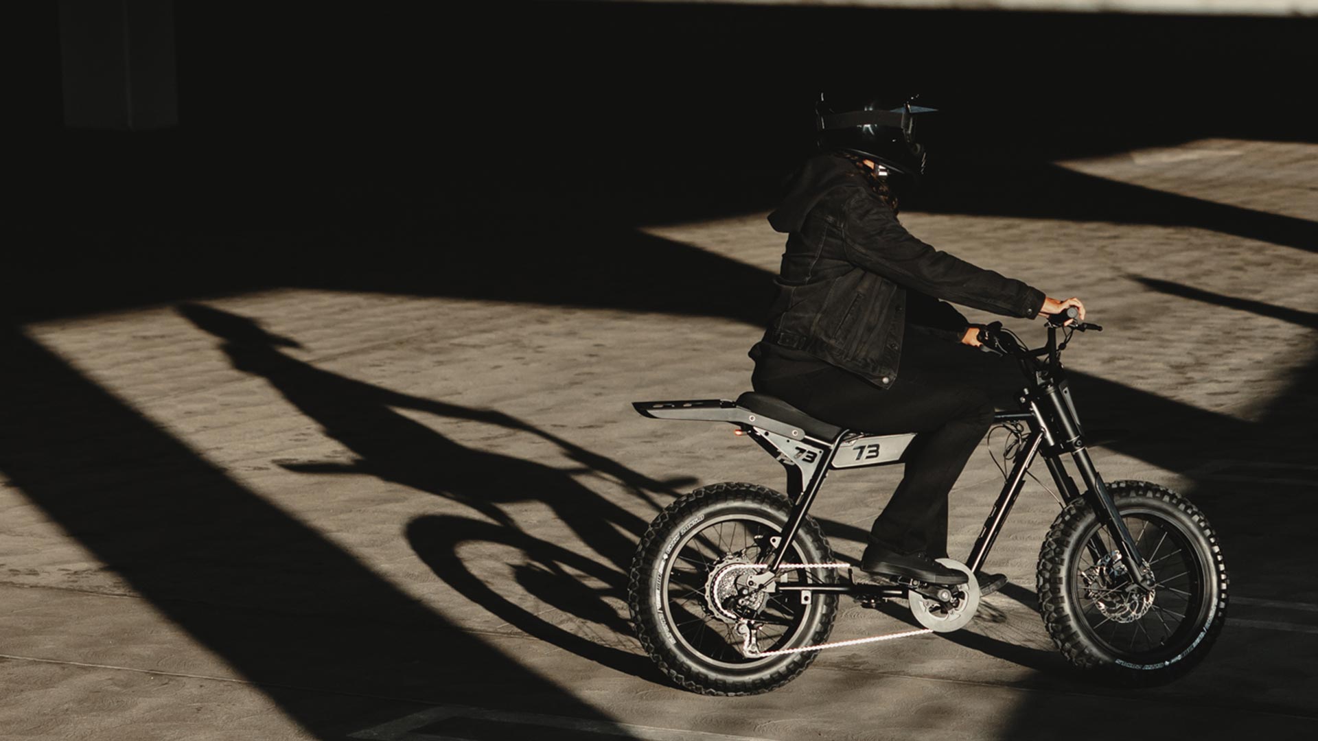 Image of a rider on the Z Blackout SE bike in a parking garage.