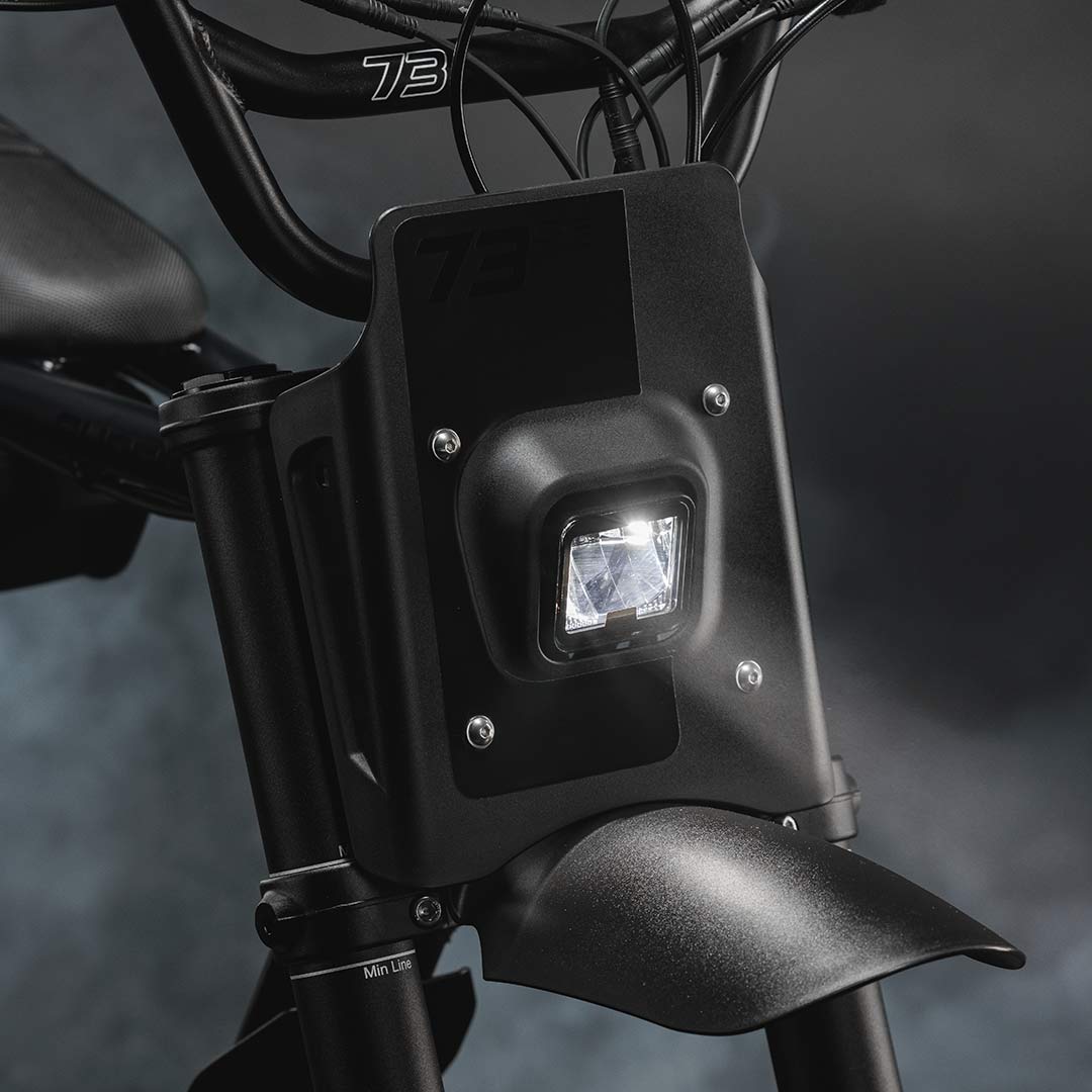 Close-up image of the LED headlight on a SUPER73-Z Blackout SE bike.