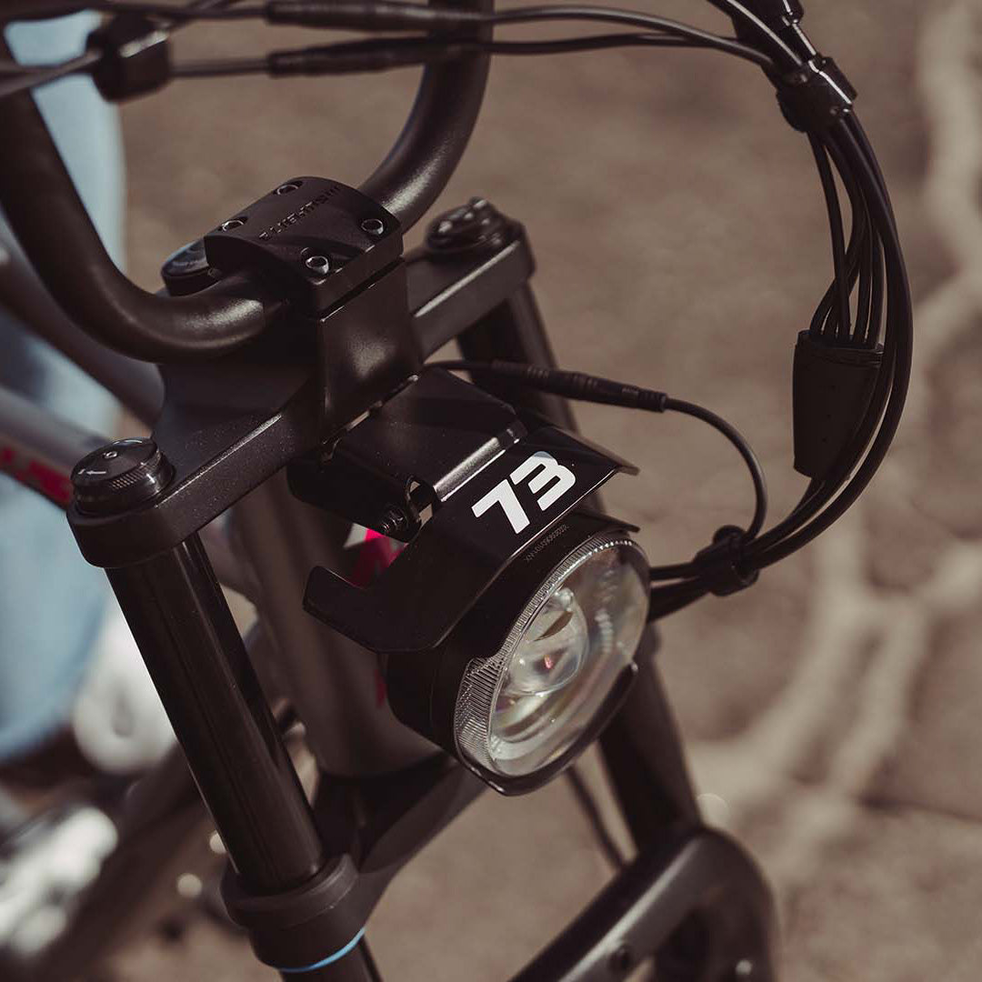 Close-up image of the headlight on the SUPER73-ZX SE ebike in Palladium