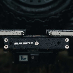 Close-up lifestyle image of the SUPER73 branding on the 1UP USA x SUPER73 Bike Rack