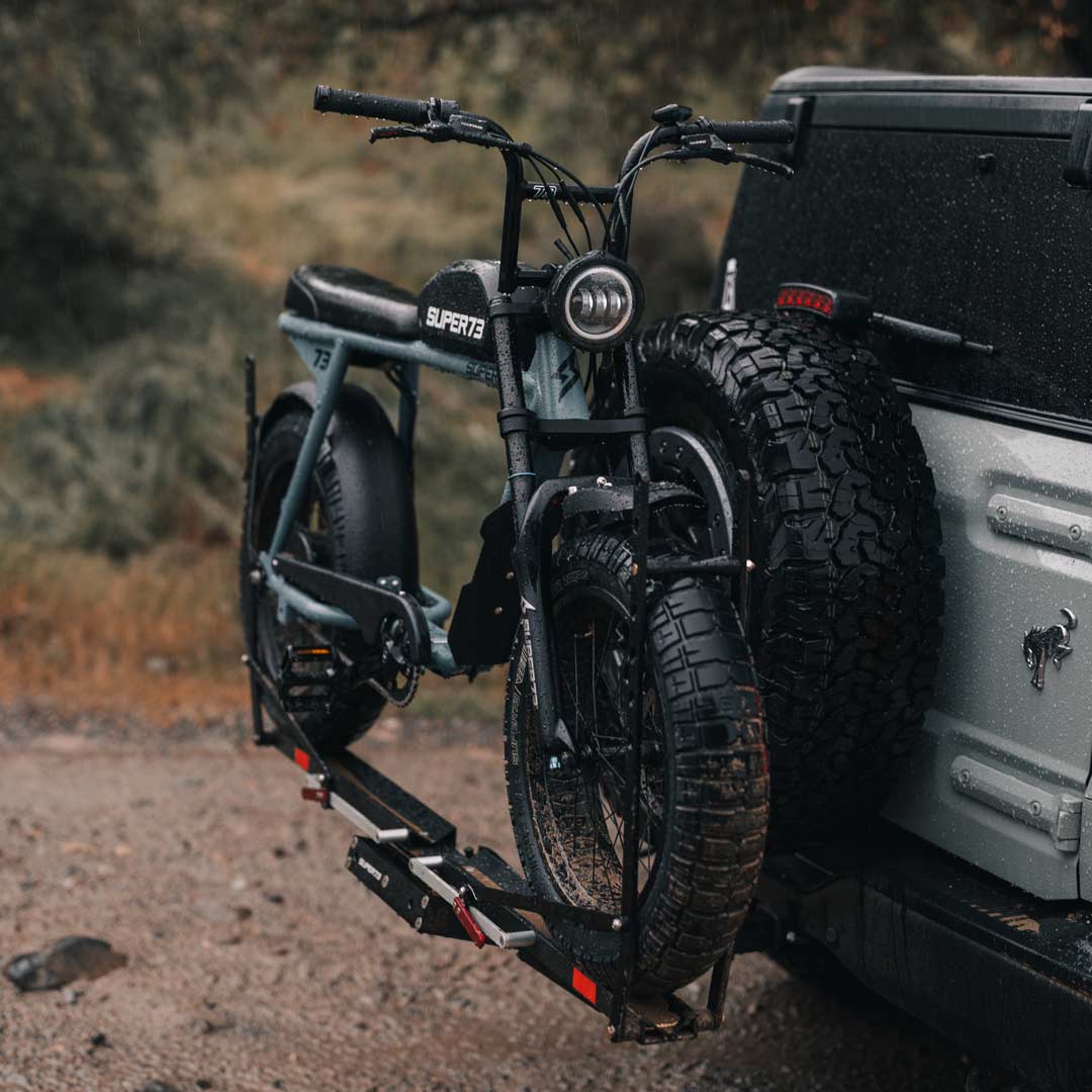Lifestyle image of a SUPER73-S2 ebike attached to the 1UP USA x SUPER73 Bike Rack on the back of a Ford Bronco.