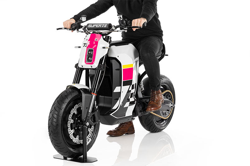 Front angle studio shot view with rider of Super73 C1X ebike on white background