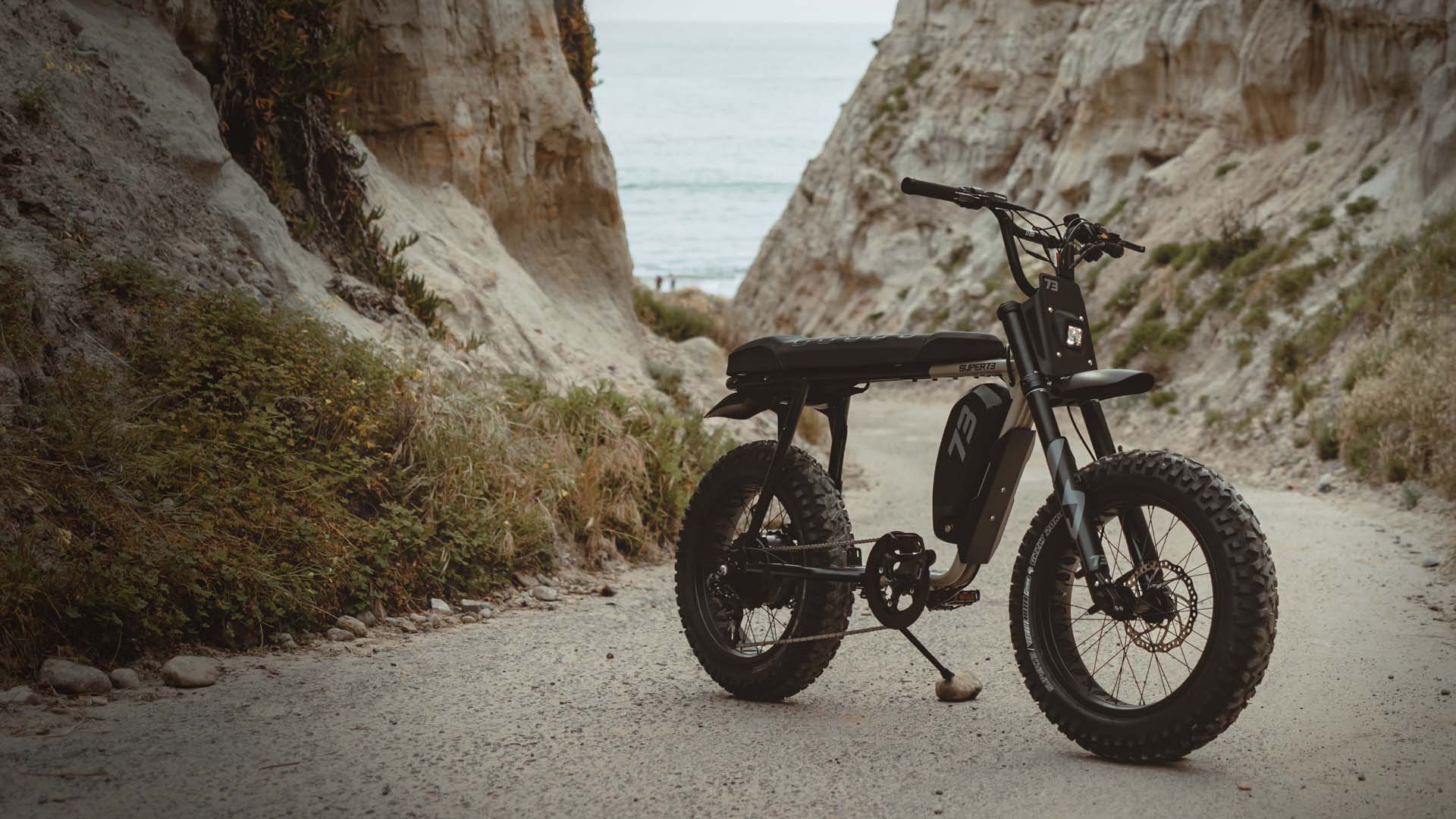 Lifestyle image of the SUPER73-S Adventure Series ebike on a beach.