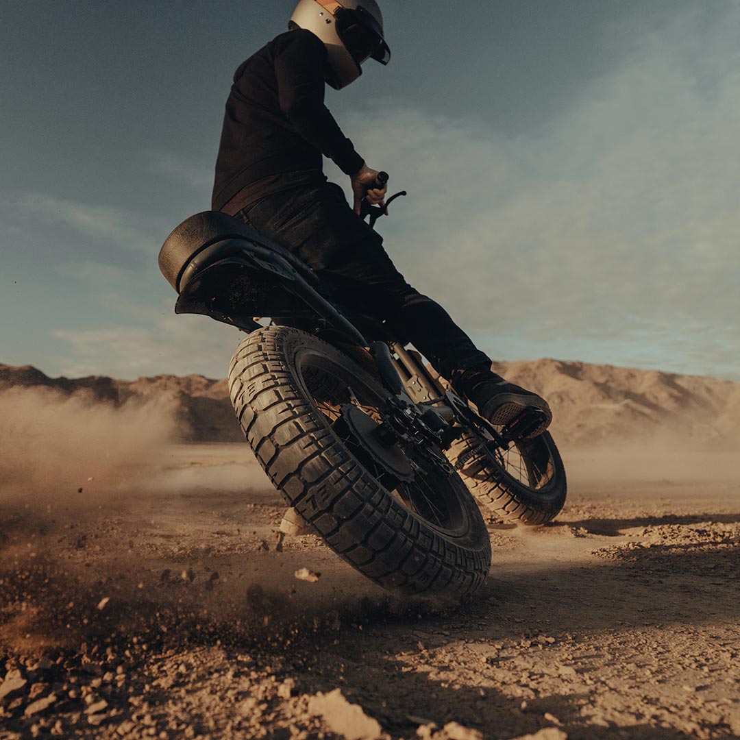 Lifestyle image of a SUPER73 rider on his ebike riding through the desert