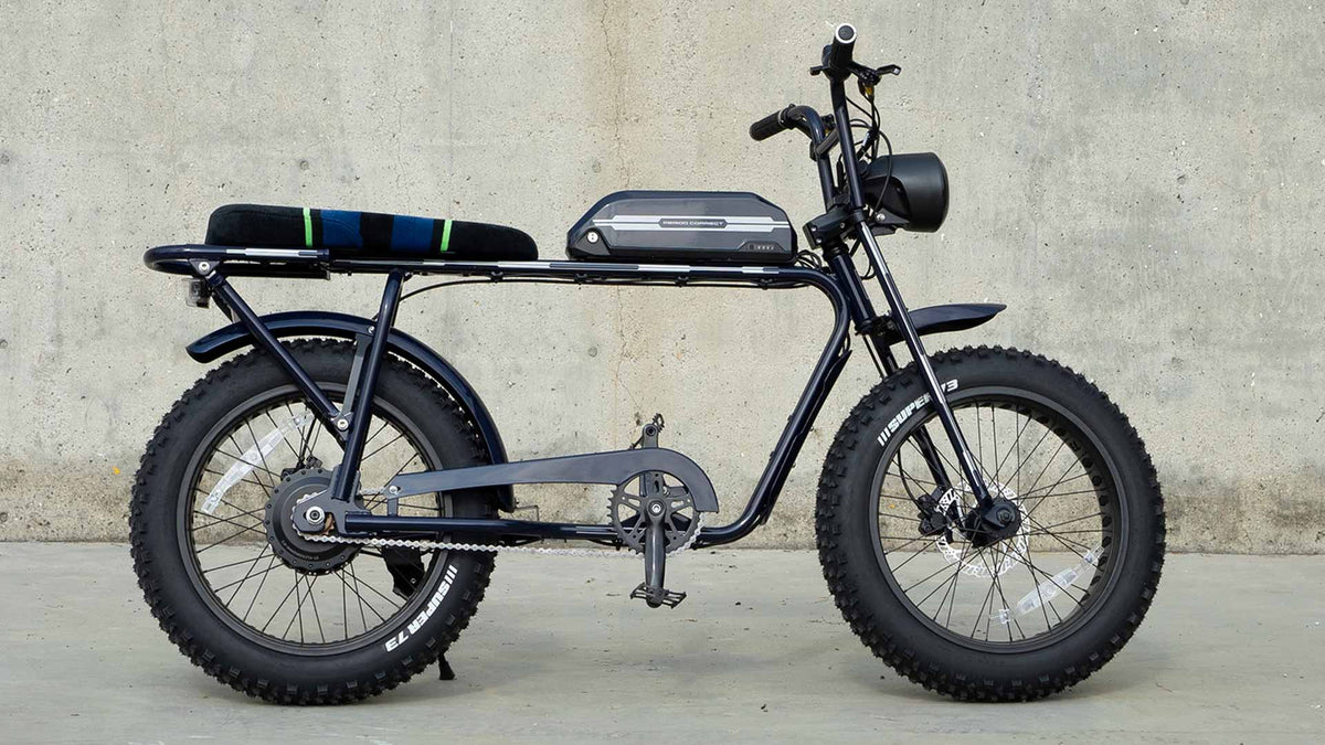 Super73 Period Correct halo custom ebike in front of concrete backdrop