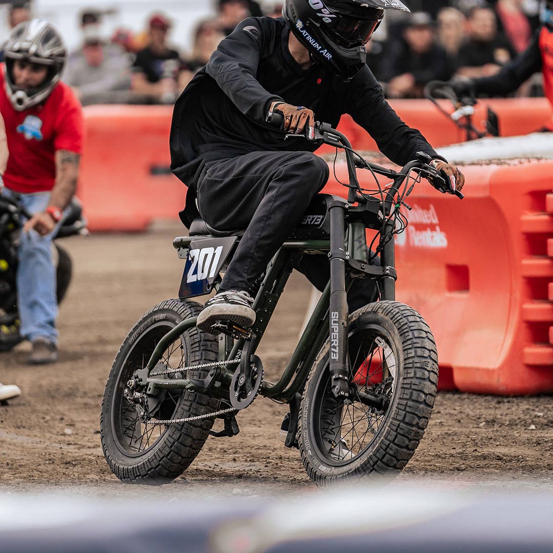 Super73 ebike rider competing in dirt track competition