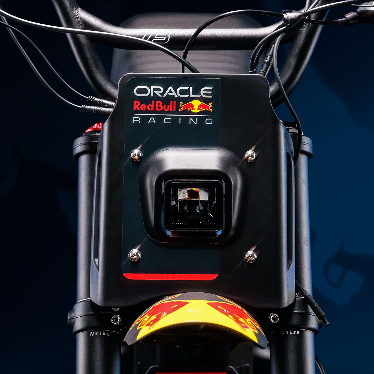 Stylized studio photo of the Oracle Red Bull Racing x SUPER73 R Adventure Series ebike.