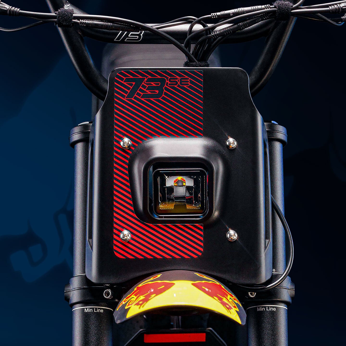 Stylized studio photo of the Oracle Red Bull Racing x SUPER73 Z Adventure Series ebike.