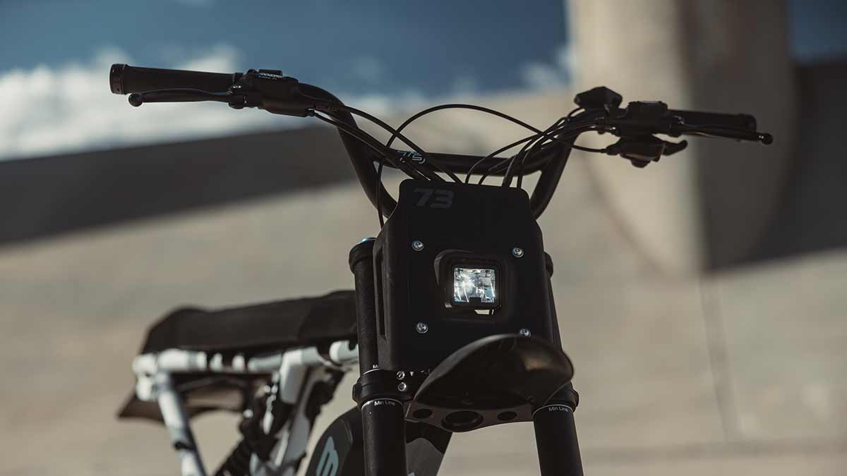 Closeup of the Super73-R Adventure Series ebike highlighting the Blain handlebar on the Snowshadow colorway